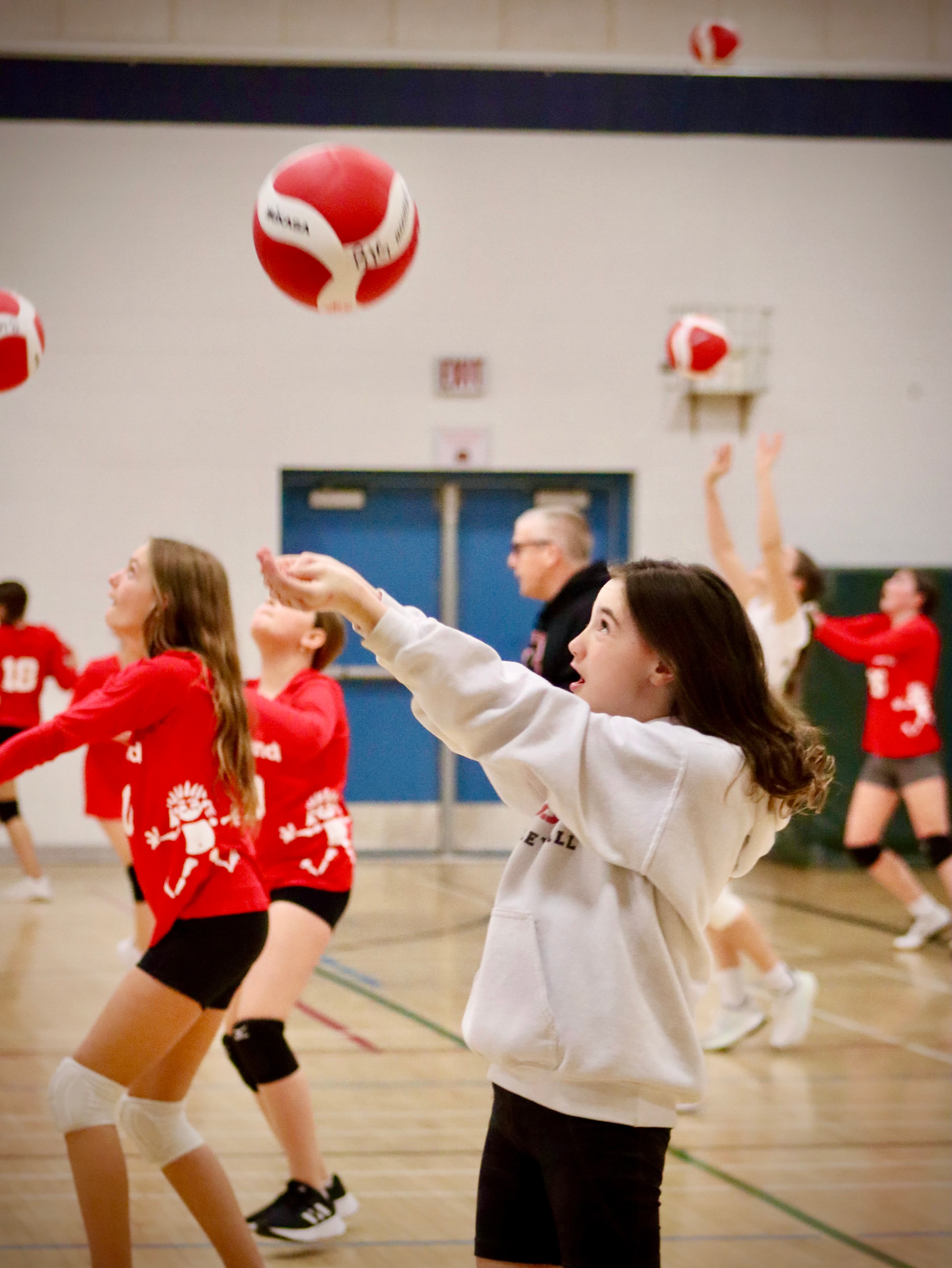 Group of girls practicing volleyball